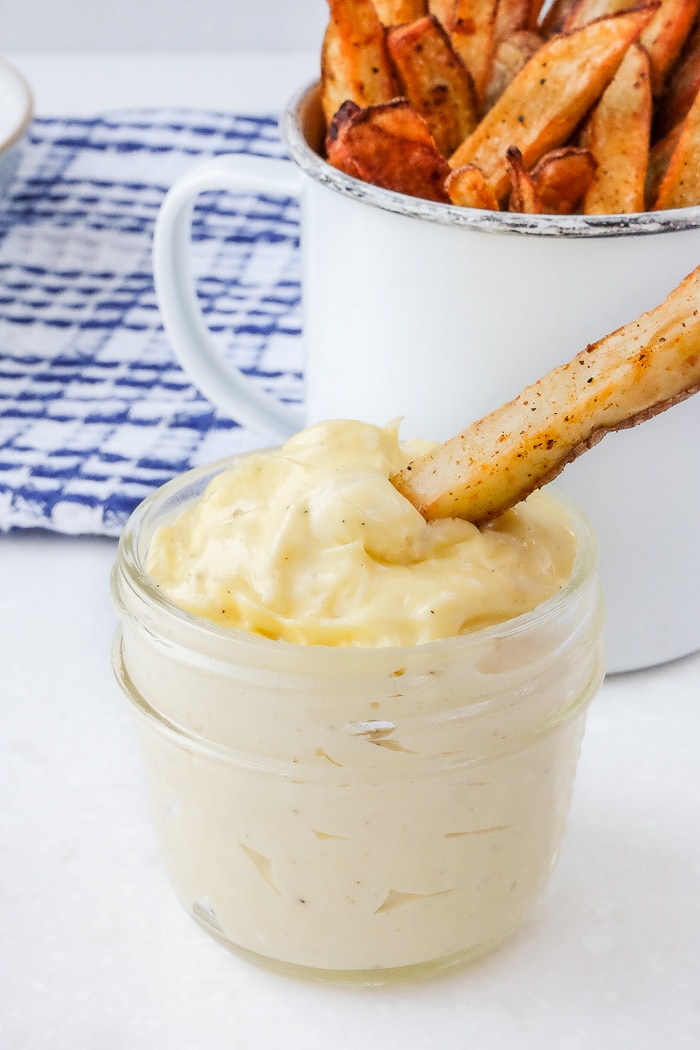 homemade french fry dipped in bowl of homemade mayo