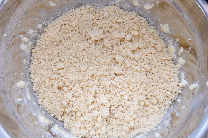 shortbread crumbles in silver mixing bowl