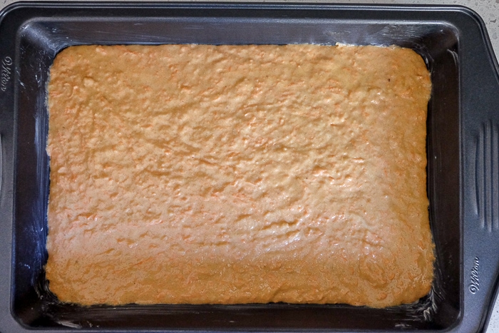 raw carrot cake batter in rectangle cake pan