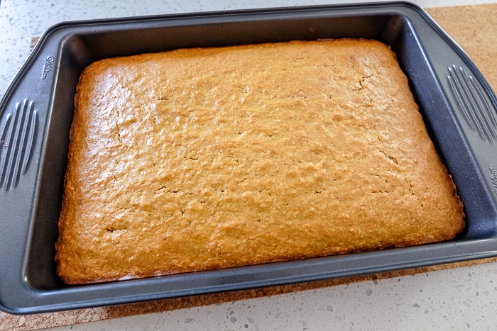 cooked carrot cake in rectangle pan on counter