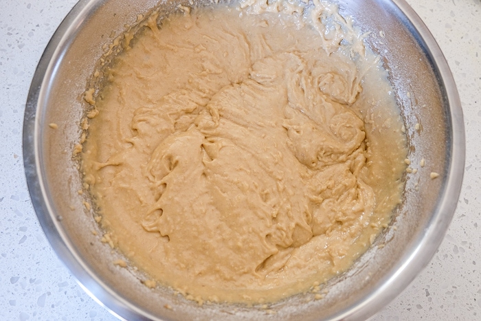 thick carrot cake batter in bowl on counter
