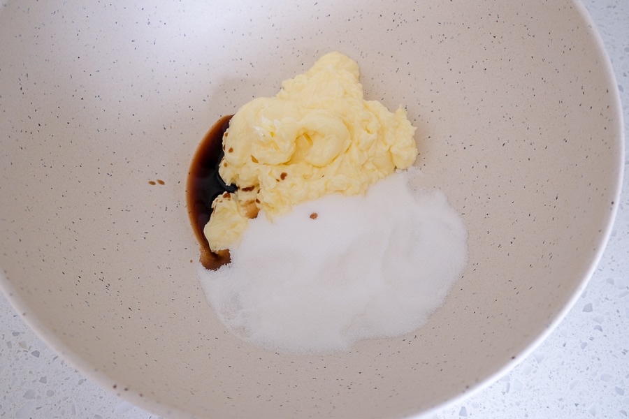 butter and sugar in white mixing bowl on white counter top
