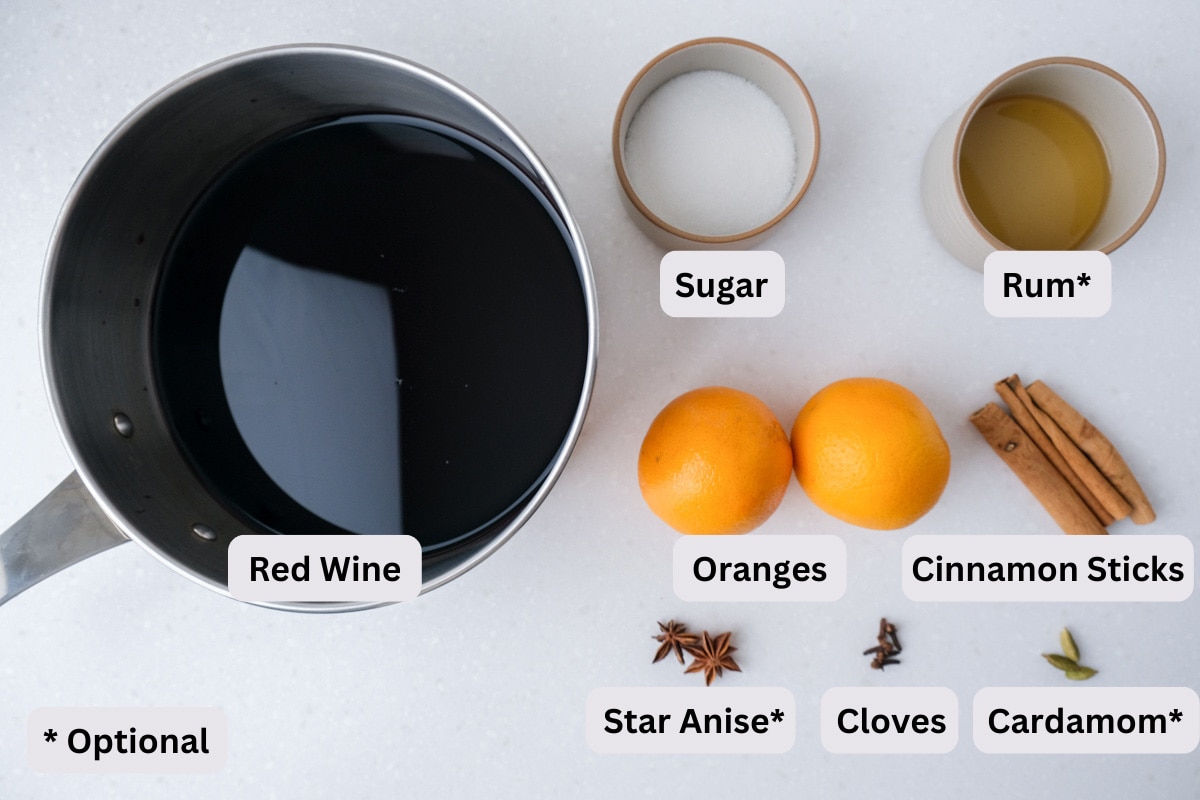ingredients for mulled wine on counter top with labels seen from above.
