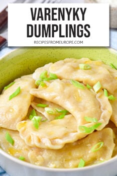 cooked dumplings with green onions on top and text overlay "varenyky dumplings".