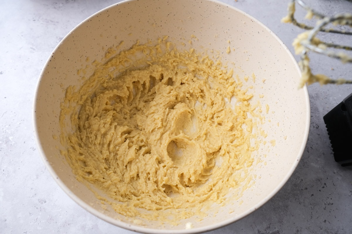 creamy butter mixture in bottom of large mixing bowl.