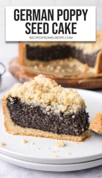 slice of poppy seed cake on plate with rest of cake in background and text overlay "German Poppy Seed Cake".