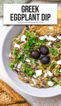 eggplant dip with parsley, feta, and olives on top plus text overlay "Greek Eggplant Dip".