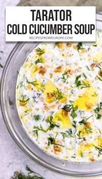 creamy cold soup with cucumber and parsley on top plus text overlay "Tarator Cold Cucumber Soup".
