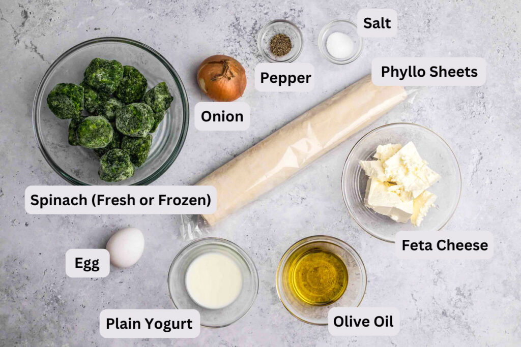 ingredients to make burek in bowls on grey counter with label.