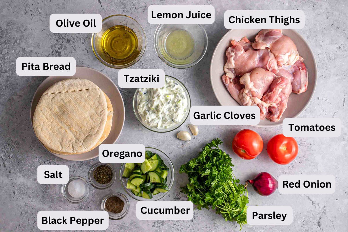 ingredients in bowls with labels seen from above for chicken gyros.
