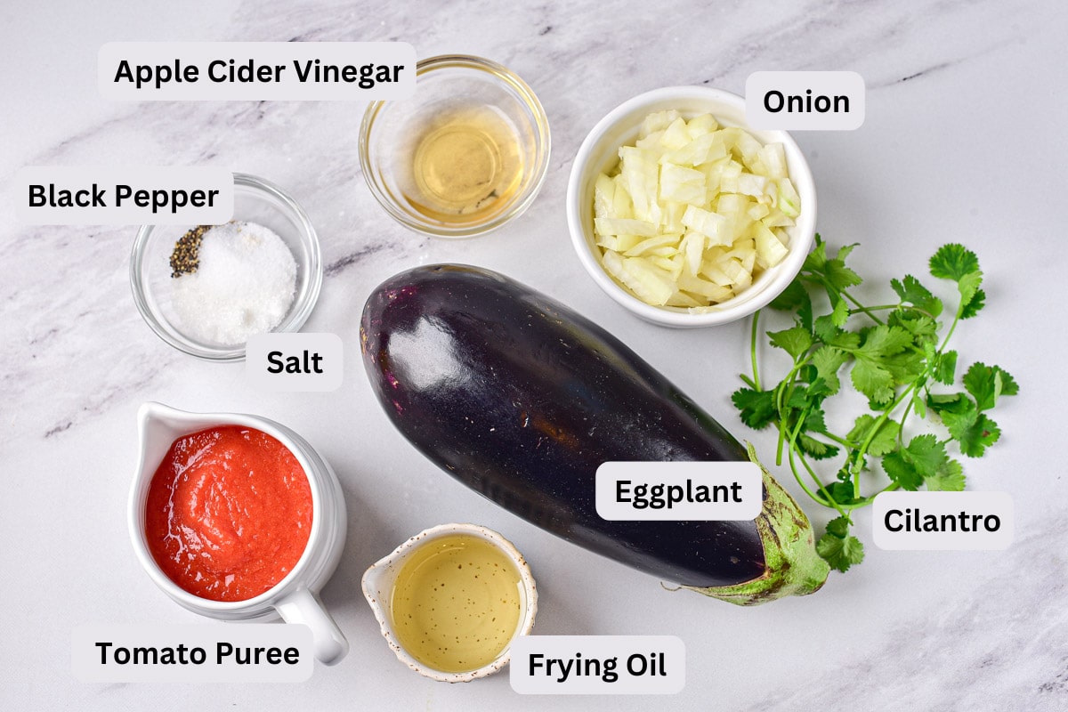ingredients on counter in bowls with labels for eggplant mezhivo.