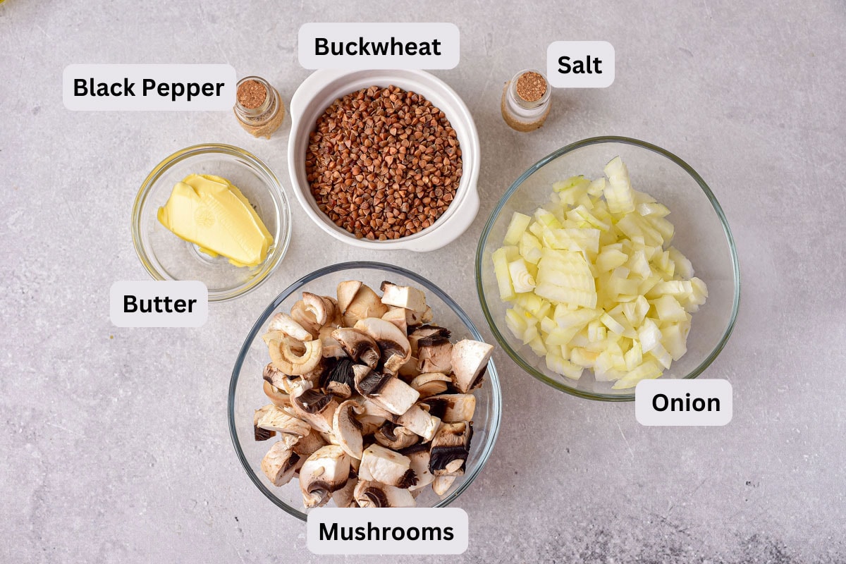 ingredients to make buckwheat porridge on counter in bowls with labels.