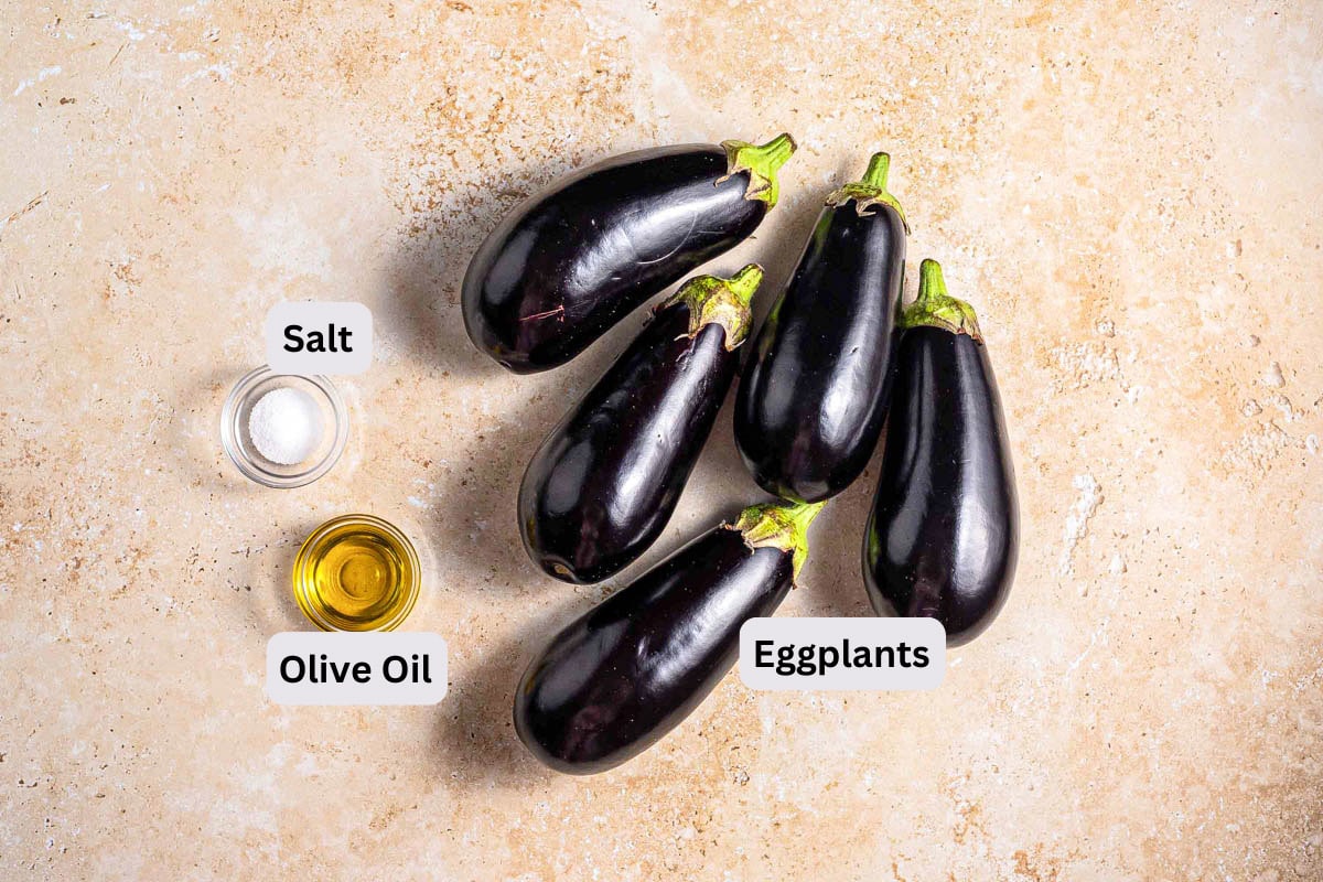 eggplants and salt and oil on counter with labels seen from above.