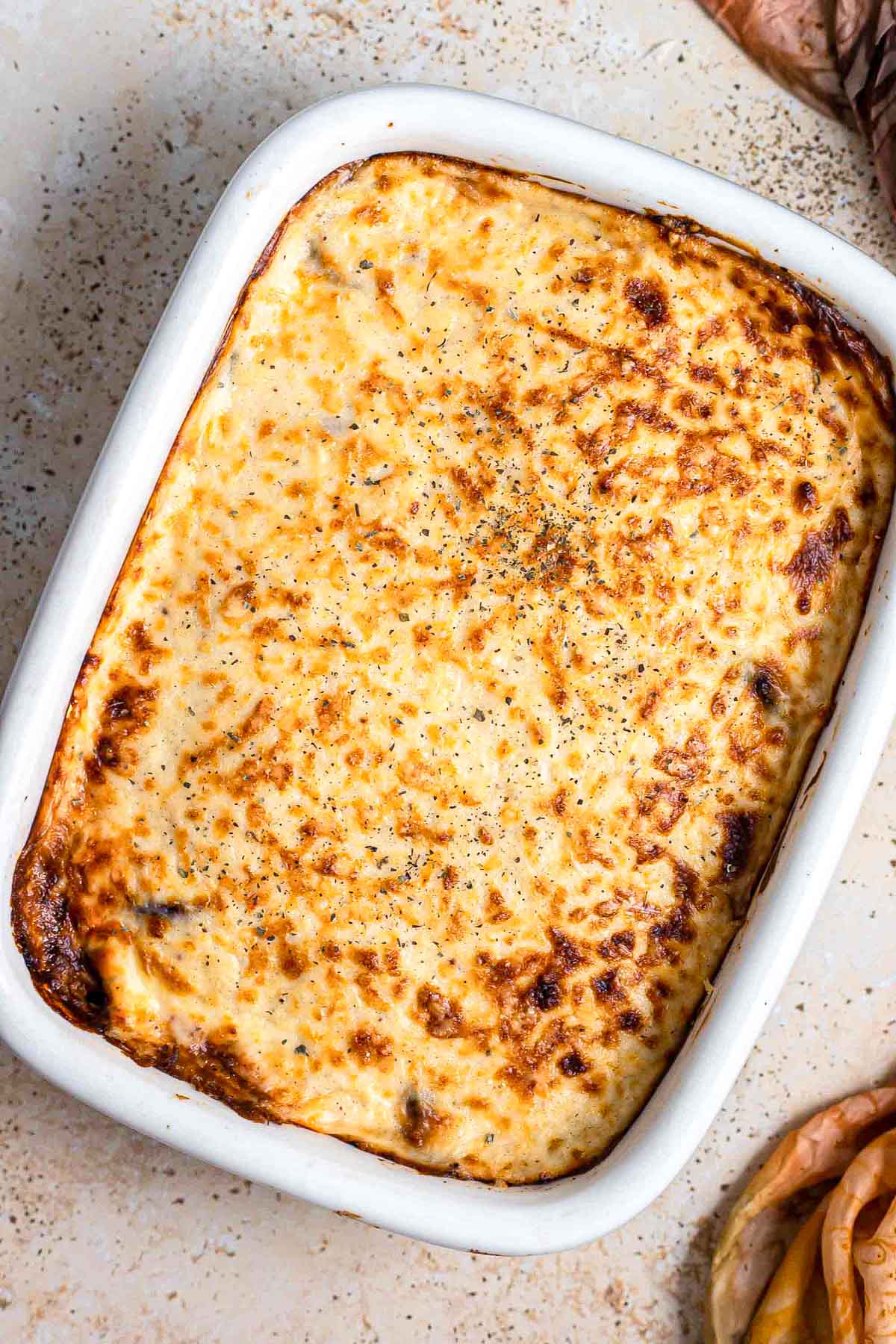 baked moussaka in rectangle dish seen from above.