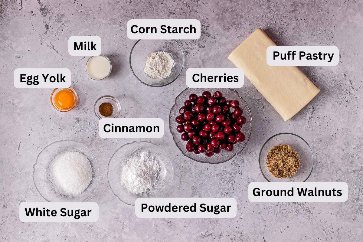 ingredients to make cherry strudel on counter in bowls with labels.