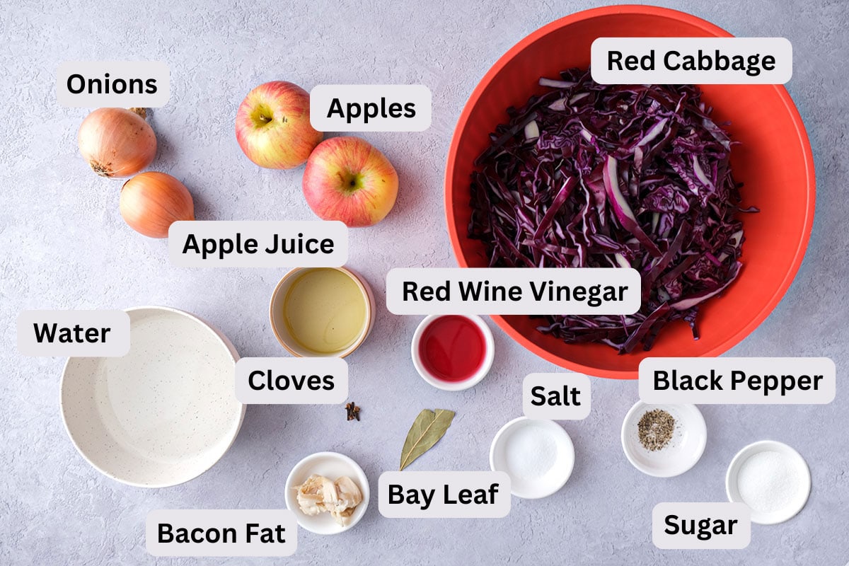 ingredients for german red cabbage on counter in bowls with labels.