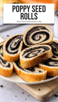 slices of poppy seed roll on white plate with text overlay "poppy seed rolls".