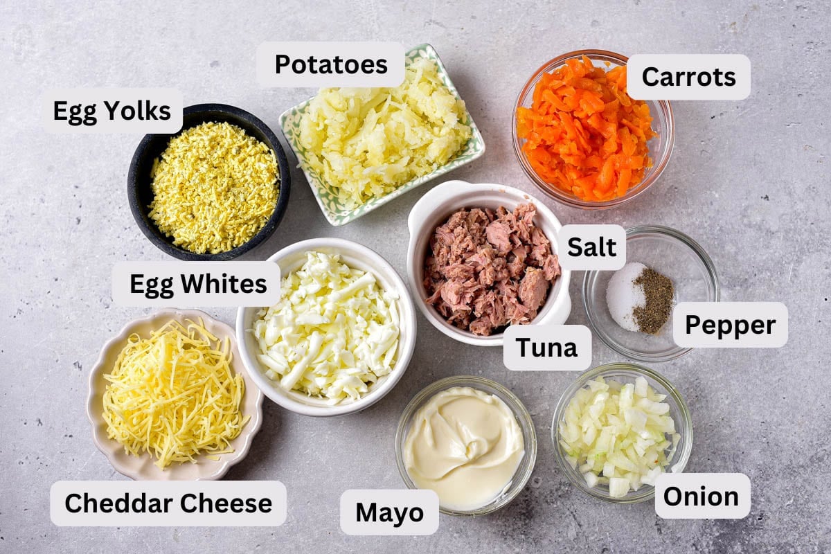 ingredients to make mimosa salad on counter in bowls with labels.