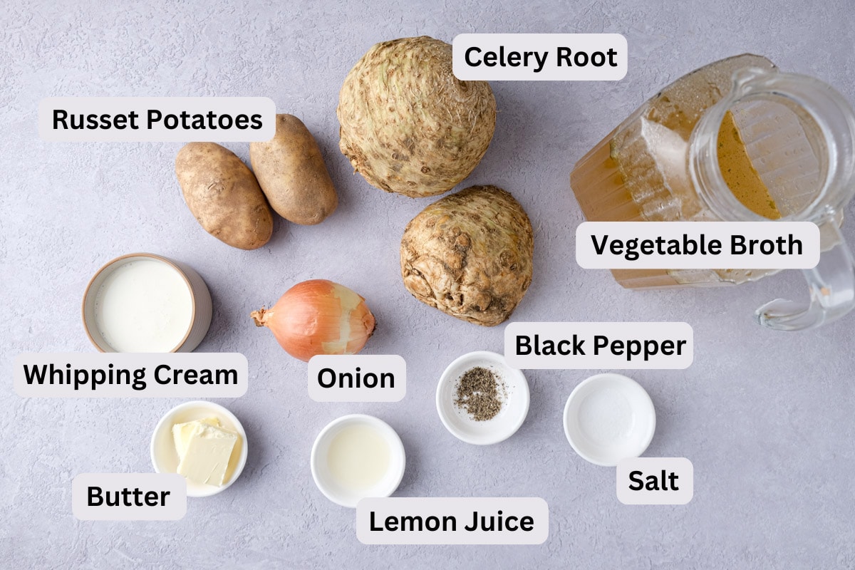 ingredients to make celeriac soup in bowl with labels on counter.