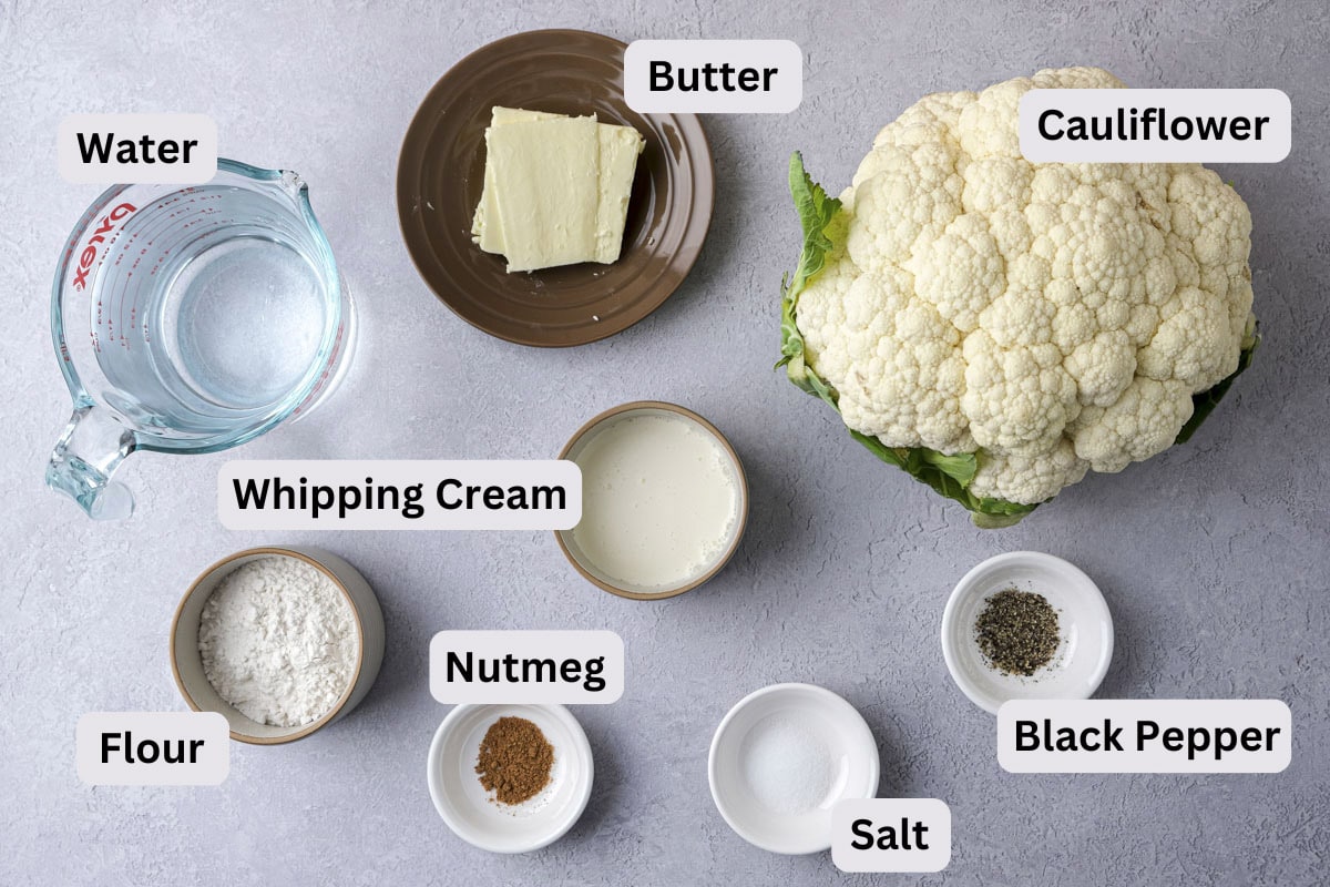 cauliflower soup ingredients on counter in bowls with labels.