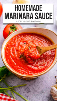 marinara sauce in bowl with wooden spoon and text overlay "homemade marinara sauce".
