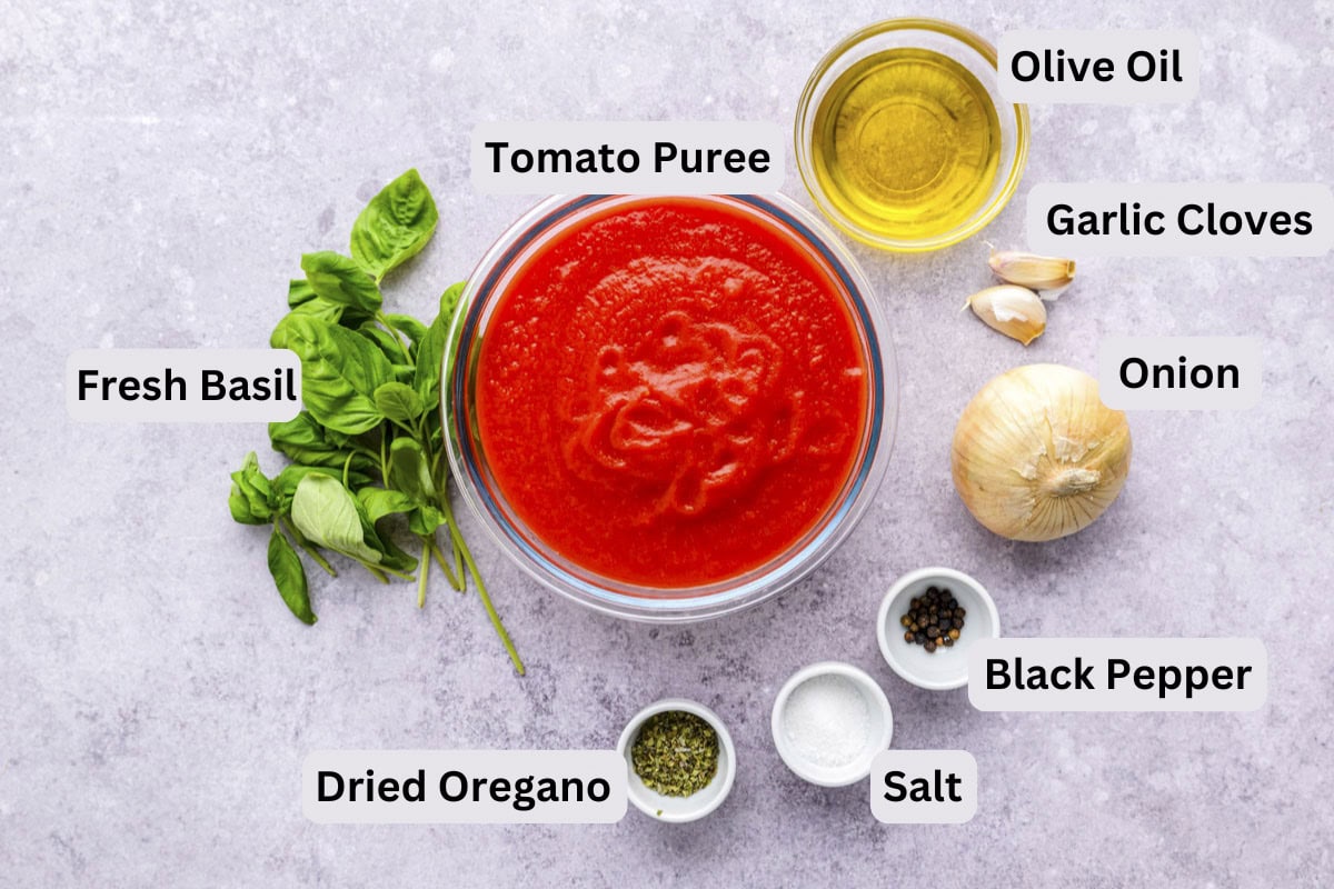 ingredients to make italian marinara sauce on counter with labels beside.