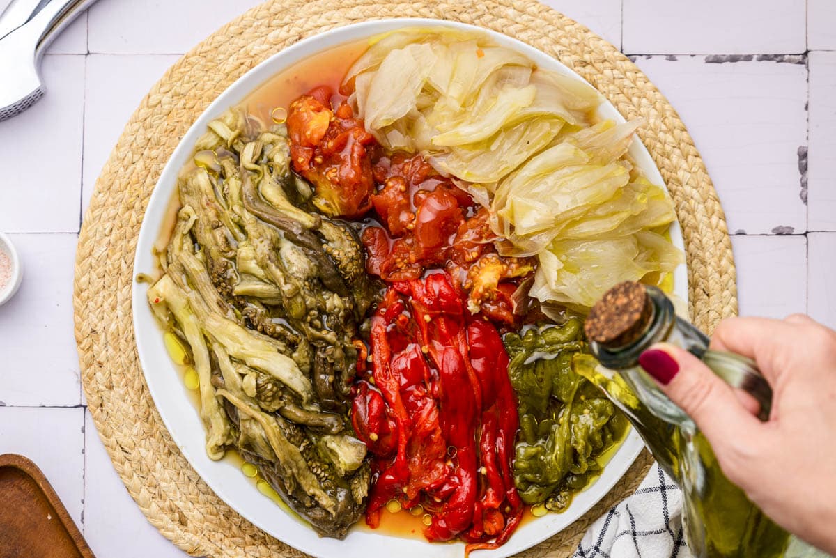 plate of roasted vegetables with olive oil poured on top.
