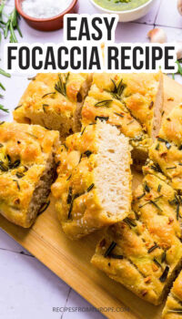 slices of focaccia with rosemary on cutting board and text overlay "easy focaccia recipe".