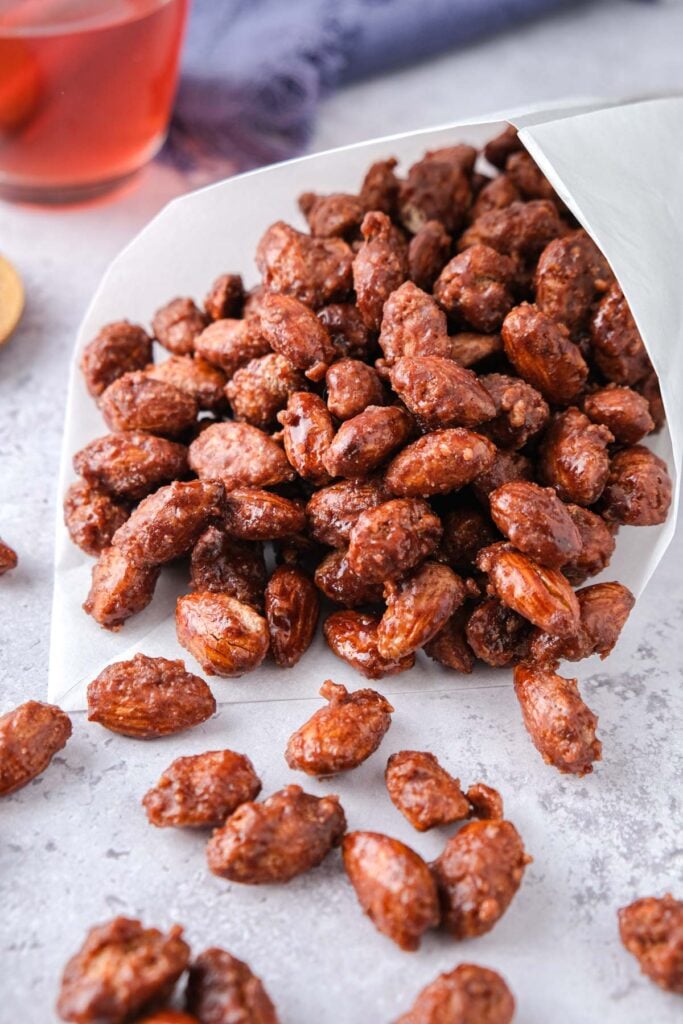 candied almonds in white cone on kitchen counter.