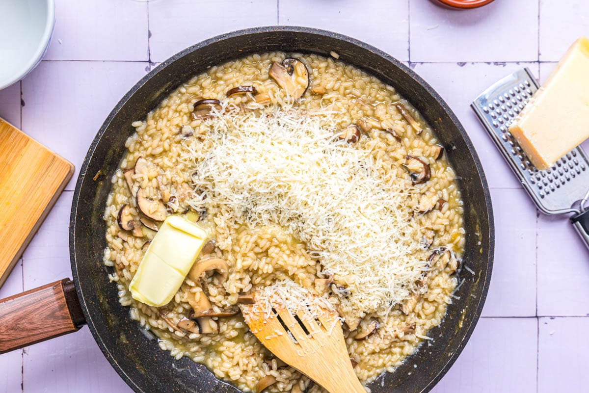 mushroom risotto with shredded cheese and butter on top.