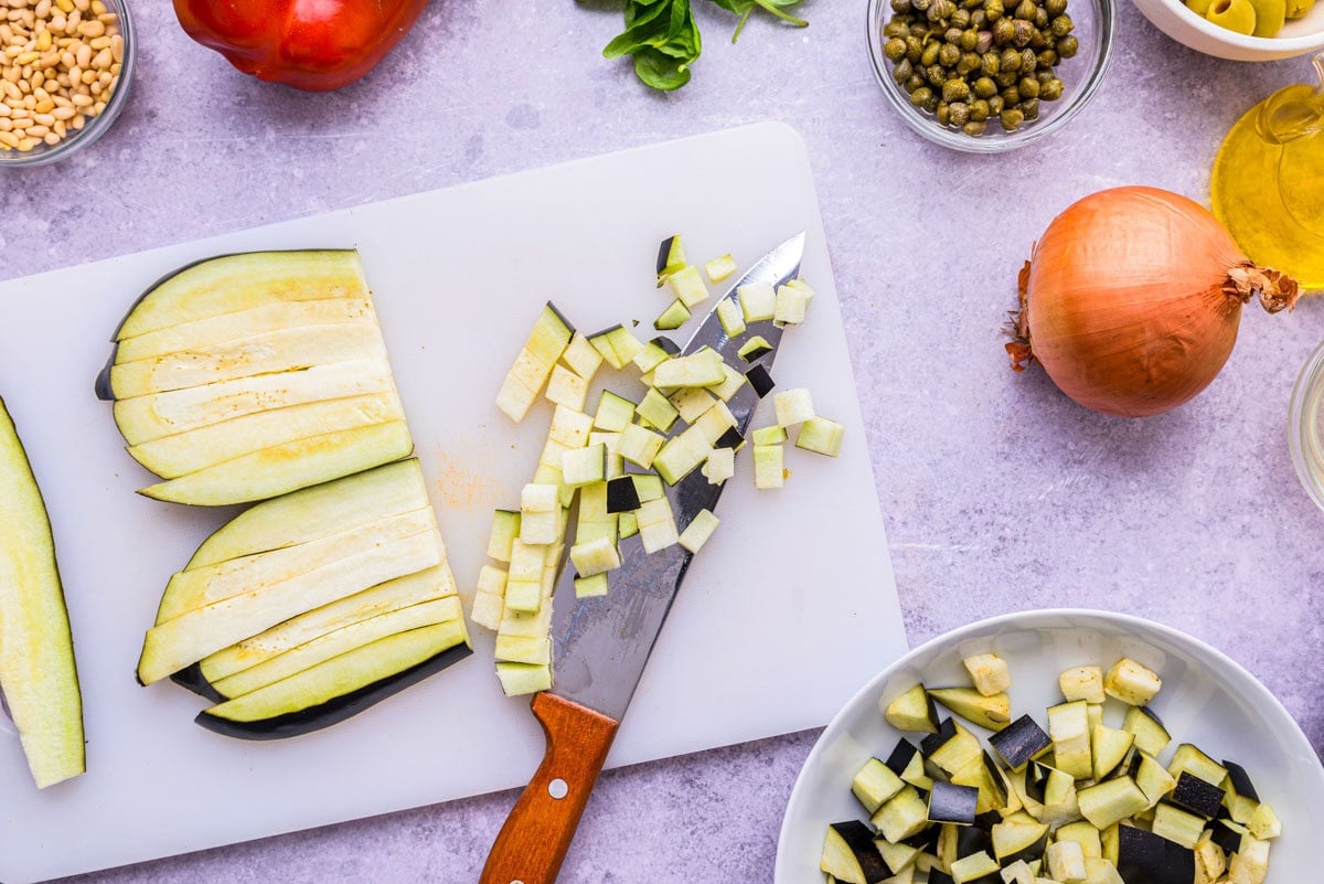 eggplant diced up on cutting board.