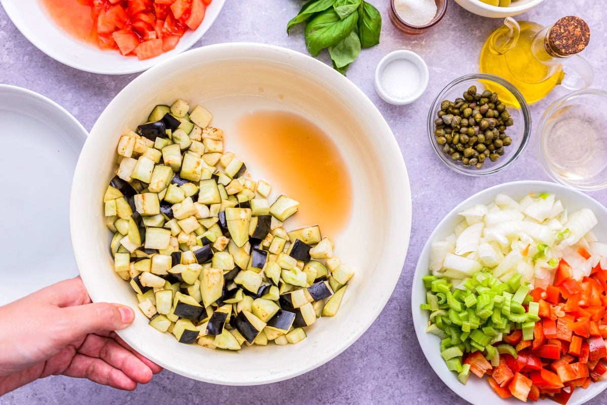 liquid drained out of diced eggplant in bowl.