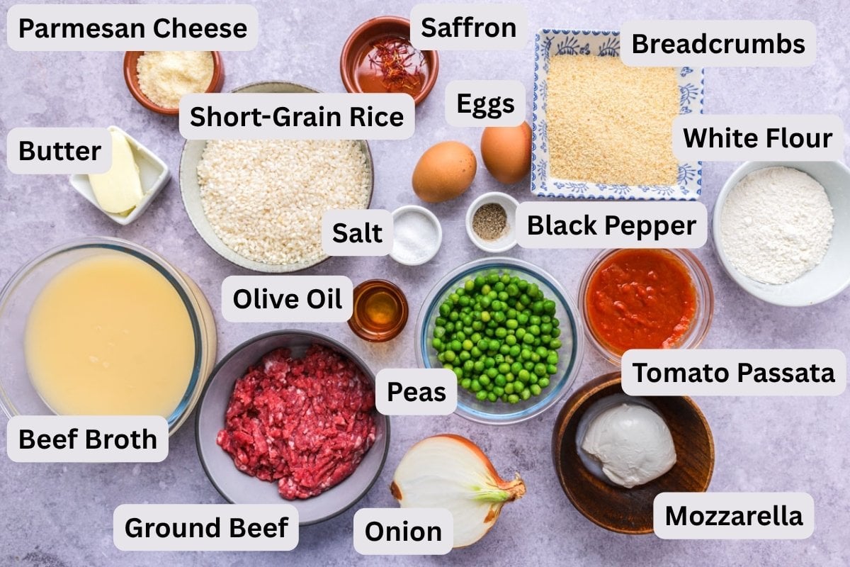 ingredients for italian rice balls in bowls on counter with labels.