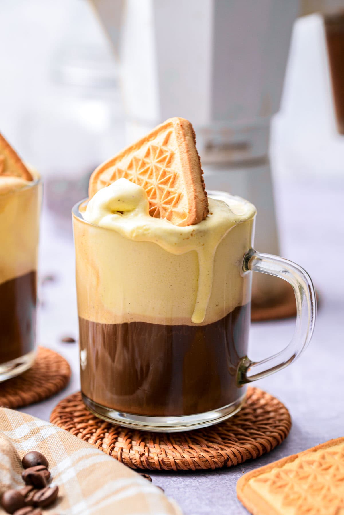 single mug of affogato on cork coaster on counter.