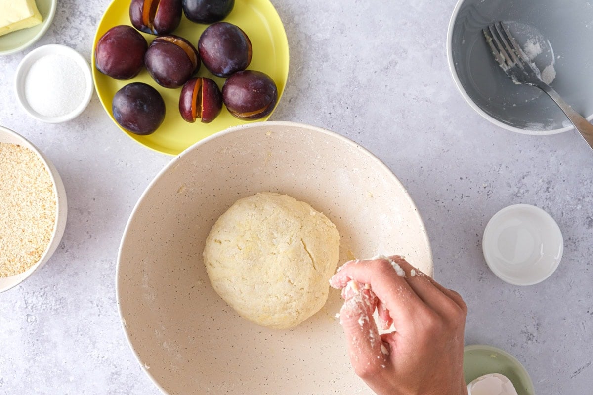 ball of dough in mixing bowl on counter.